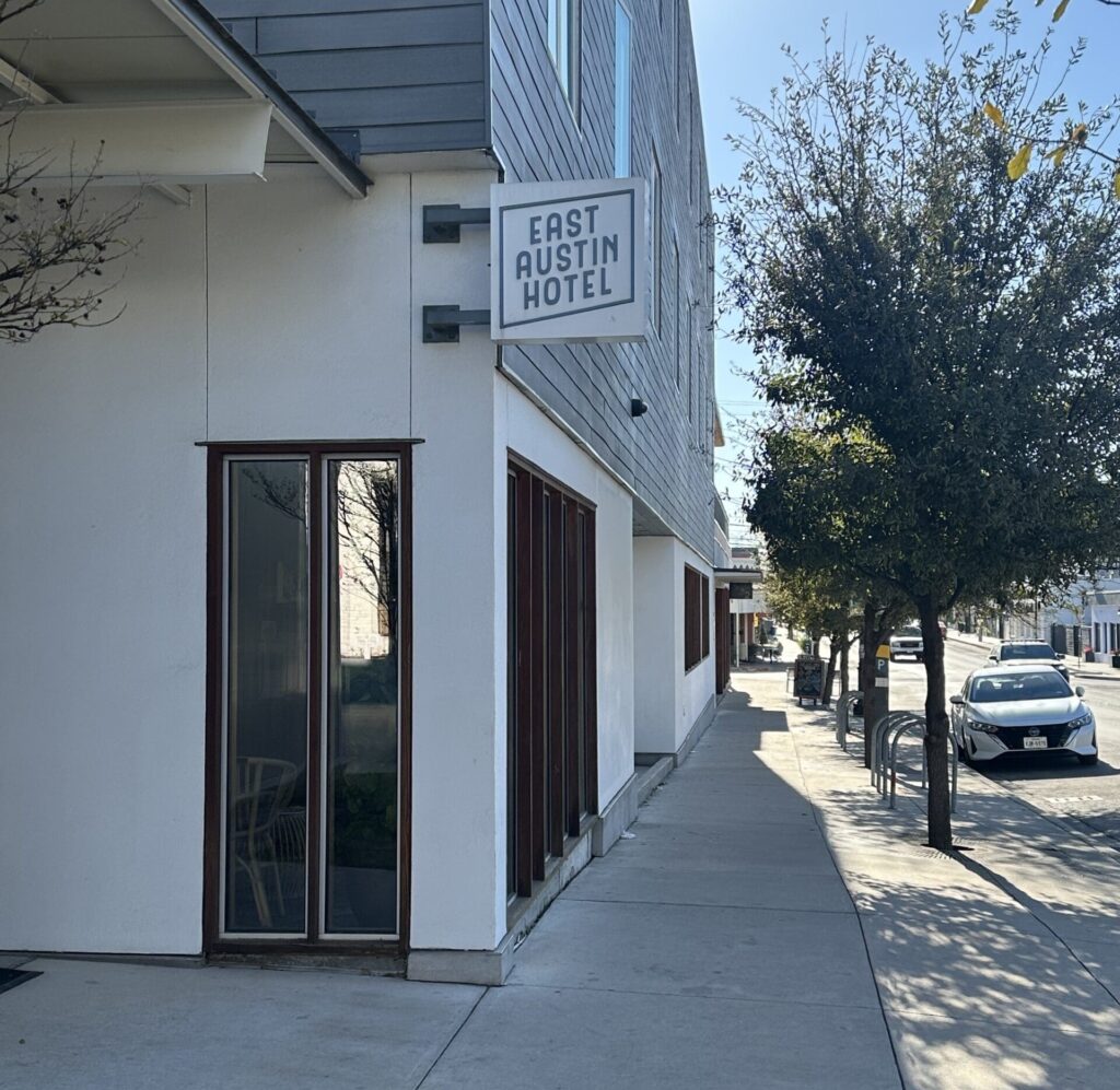 Small sign for the East Austin Hotel on E 6th St